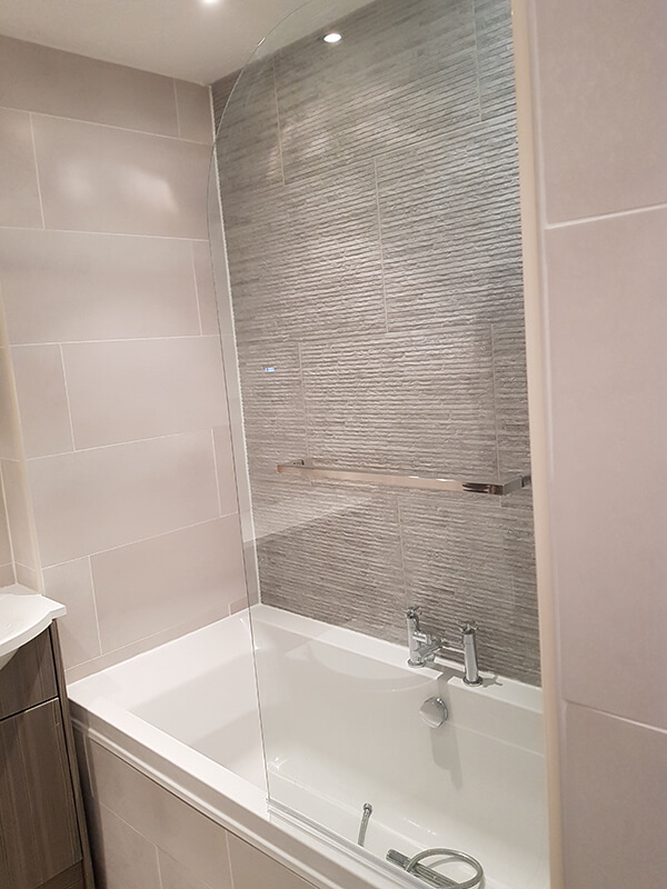 Modern tiled bathroom with shower screen